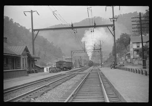 Coal train going through center of mining town. Davey, West Virginia