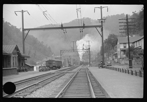 Untitled photo, possibly related to: Coal train going through center of mining town. Davey, West Virginia