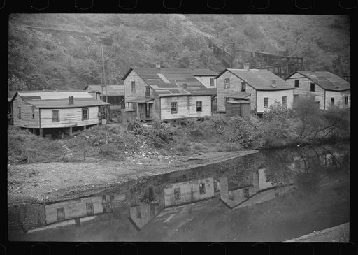 Houses in abandoned mining town with remains of coal tipple at right, Mohegan, West Virginia