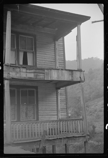 Untitled photo, possibly related to: Former miners' boardinghouse now inhabited by seven families, almost all on relief in abandoned mining town, Mohegan, West Virginia