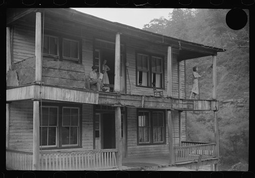 Untitled photo, possibly related to: Former miners' boardinghouse now inhabited by seven families, almost all on relief in abandoned mining town, Mohegan, West Virginia