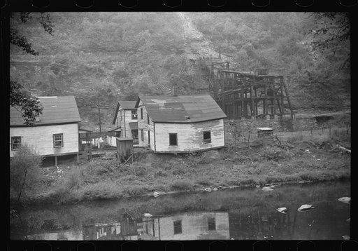 Houses in abandoned mining town with remains of coal tipple at right, Mohegan, West Virginia