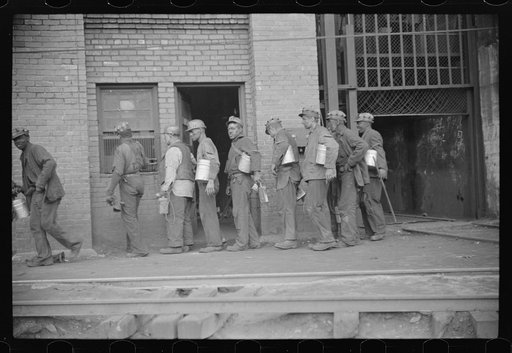 Untitled photo, possibly related to: Miners turning in lamps after getting out of cage from shaft, which goes down sixty feet to tunnel, which is two miles long. Caples, West Virginia