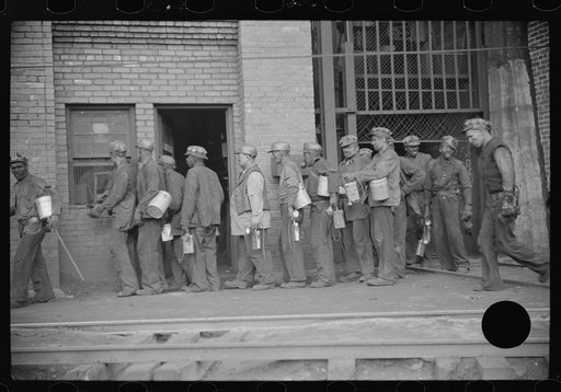 Untitled photo, possibly related to: Miners turning in lamps after getting out of cage from shaft, which goes down sixty feet to tunnel, which is two miles long. Caples, West Virginia