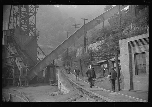 Miners starting home after work. Part of coal tipple shown at left. West Virginia