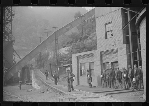 Miners turning in lamps and starting home. Caples, West Virginia