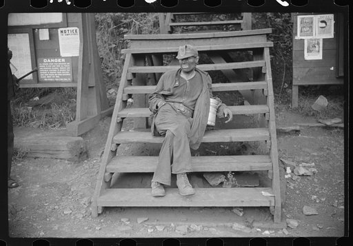 Coal miner waiting for lift home. Caples, West Virginia