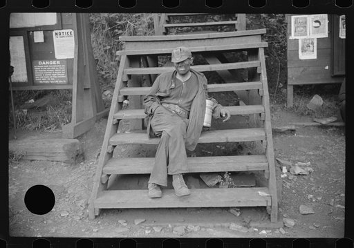 Untitled photo, possibly related to: Coal miner waiting for lift home. Caples, West Virginia