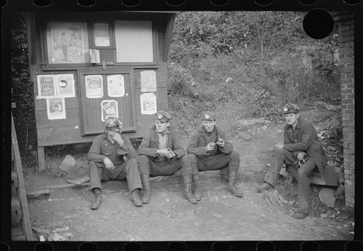 Untitled photo, possibly related to: Miners starting home after work. Part of coal tipple shown at left. West Virginia