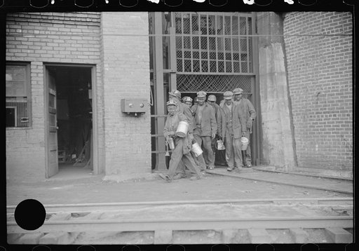 Untitled photo, possibly related to: Miners turning in lamps and starting home. Caples, West Virginia