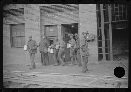 Untitled photo, possibly related to: Miners turning in lamps and starting home. Caples, West Virginia