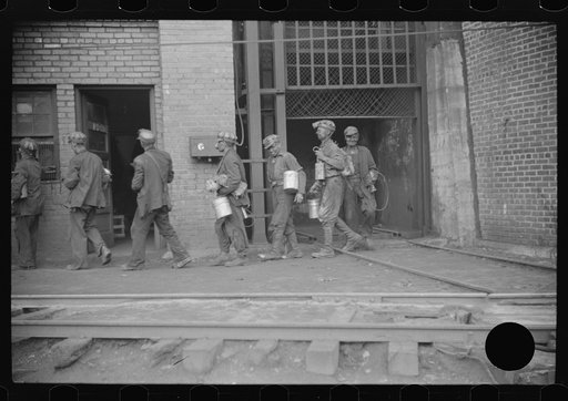 Untitled photo, possibly related to: Miners turning in lamps and starting home. Caples, West Virginia