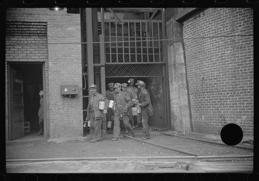 Untitled photo, possibly related to: Miners turning in lamps and starting home. Caples, West Virginia