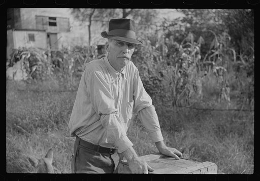 Man living in shack by river, Charleston, West Virginia