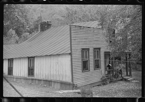 Farmhouse with false front resembling a store, on main highway between Morgantown and Elkins, West Virginia. Someone lived in one room
