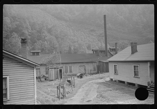 Untitled photo, possibly related to: Deserted mining town, completely boarded up, owned by Ford who closed it down rather than have it unionized. Twin Branch, West Virginia