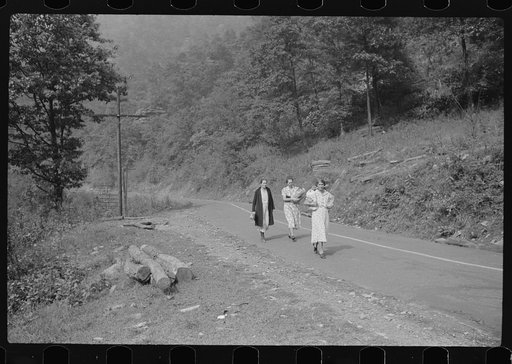 Miners' wives coming home from town with groceries on payday near Mohegan, West Virginia