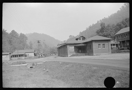 Untitled photo, possibly related to: Community building and company store in abandoned mining town, Twin Branch, West Virginia