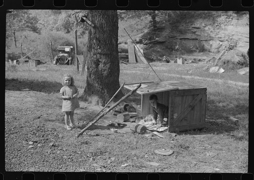 WPA (Works Progress Administration) worker's children with their toys in their play yard. South Charleston, West Virginia