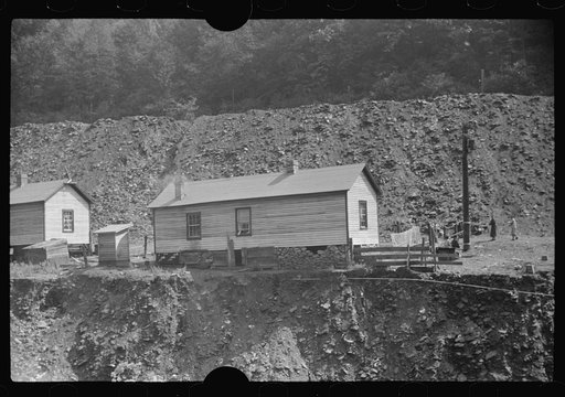 Untitled photo, possibly related to: Coal miners' homes by slate and slag heap, Caples, West Virginia