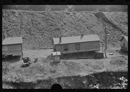 Untitled photo, possibly related to: Coal miners' homes by slate and slag heap, Caples, West Virginia