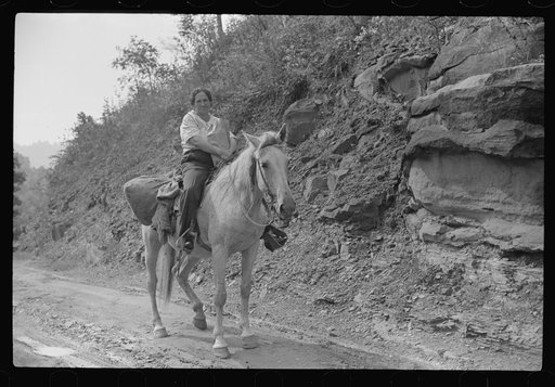 Coal miner's wife bringing groceries from company store, Caples, West Virginia