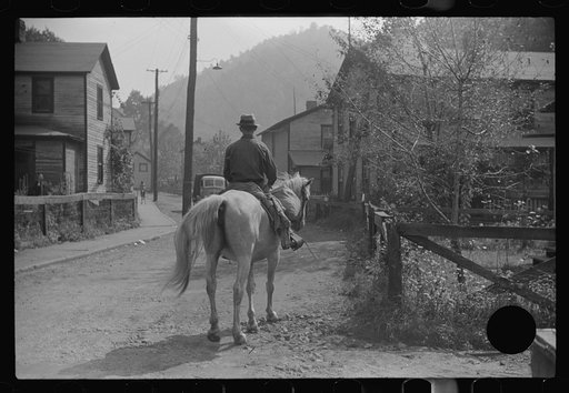 Untitled photo, possibly related to: Miner taking home provisions, Caples, West Virginia
