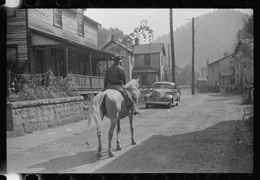 Miner taking home provisions, Caples, West Virginia