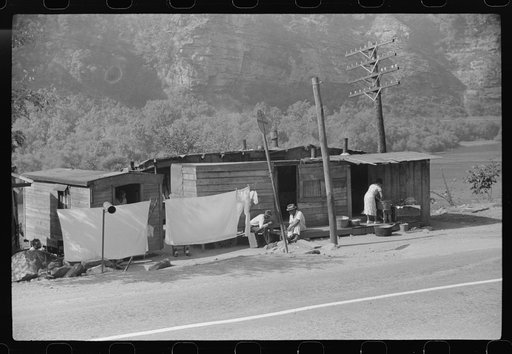 Shacks being inhabited by Negroes along highway between Charleston and Gauley Bridge, West Virginia