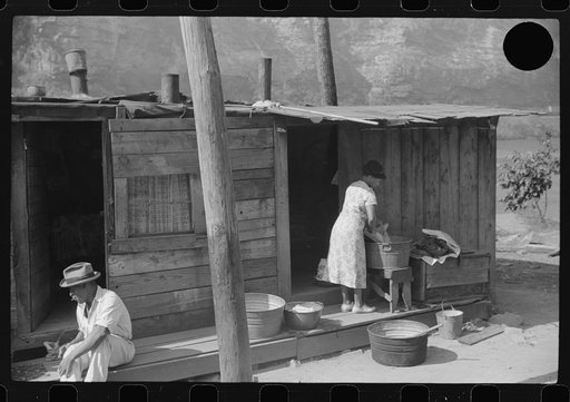 Untitled photo, possibly related to: Playing checkers with bottle caps along highway between Charleston and Gauley Bridge, West Virginia