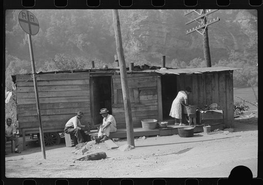 Untitled photo, possibly related to: Playing checkers with bottle caps along highway between Charleston and Gauley Bridge, West Virginia