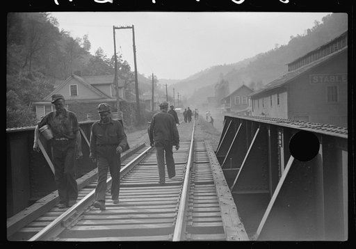 Untitled photo, possibly related to: Coal miners returning to and from work and children going from school along tracks, Omar, West Virginia