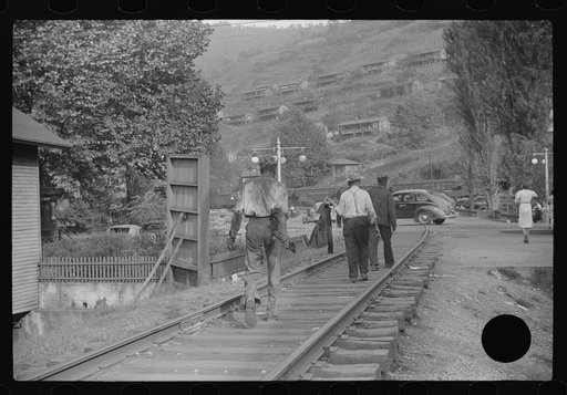 Untitled photo, possibly related to: Coal miners returning to and from work and children going from school along tracks, Omar, West Virginia