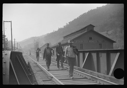 Untitled photo, possibly related to: Coal miners returning to and from work and children going from school along tracks, Omar, West Virginia