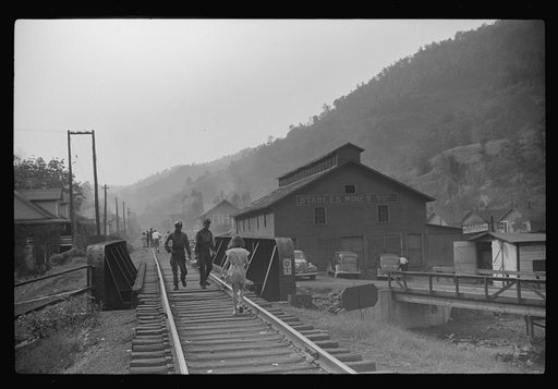Coal miners returning to and from work and children going from school along tracks, Omar, West Virginia