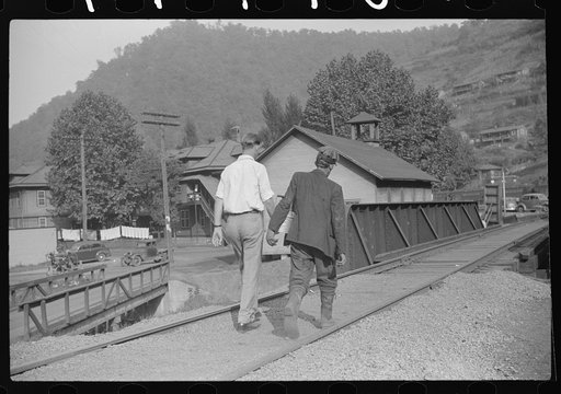 Coal miner going home with friend after work. Many miners are lame. Omar, West Virginia