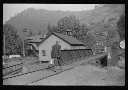 Untitled photo, possibly related to: Coal miner going home with friend after work. Many miners are lame. Omar, West Virginia