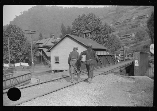 Untitled photo, possibly related to: Coal miner going home with friend after work. Many miners are lame. Omar, West Virginia