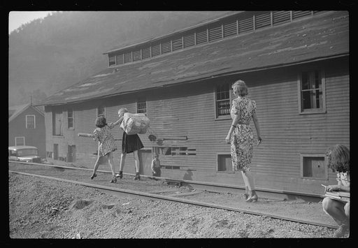 Miners' children going home from store and post office, Omar, West Virginia