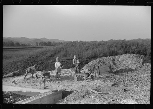 Untitled photo, possibly related to: Homesteaders' children playing in pile of sand, Tygart Valley, West Virginia