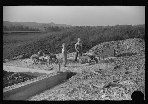 Untitled photo, possibly related to: Homesteaders' children playing in pile of sand, Tygart Valley, West Virginia