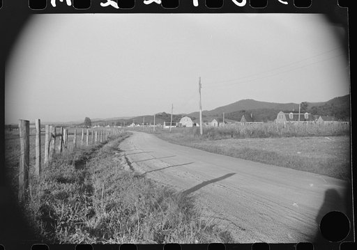 Untitled photo, possibly related to: Homesteader's son bringing home some potatoes he got out of community garden, Tygart Valley, West Virginia