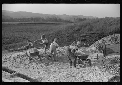 Homesteaders' children playing in pile of sand, Tygart Valley, West Virginia