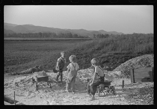 Untitled photo, possibly related to: Homesteaders' children playing in pile of sand, Tygart Valley, West Virginia