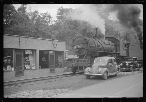 Train pulling coal through center of town morning and evenings, Osage, West Virginia