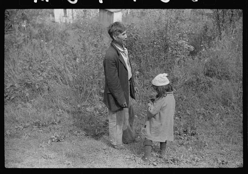 Untitled photo, possibly related to: Mexican miner and child, Bertha Hill, West Virginia. Many Mexicans and Negroes were brought into Scotts Run around 1926 to break the strike. Now about one fourth of all mines employ any at all and these, only very small percent and "only the cream." They are gene