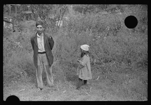 Untitled photo, possibly related to: Mexican miner and child, Bertha Hill, West Virginia. Many Mexicans and Negroes were brought into Scotts Run around 1926 to break the strike. Now about one fourth of all mines employ any at all and these, only very small percent and "only the cream." They are gene
