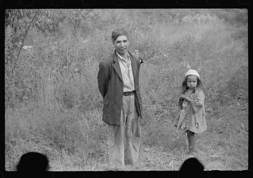Mexican miner and child, Bertha Hill, West Virginia. Many Mexicans and Negroes were brought into Scotts Run around 1926 to break the strike. Now about one fourth of all mines employ any at all and these, only very small percent and "only the cream." They are generally accepted by other folks and the