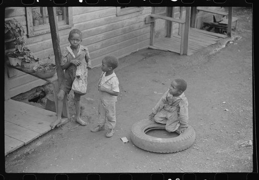 Coal miner's children play in front yard, Chaplin, West Virginia