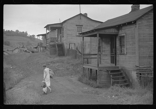 Coal miner's wife and child on main road in community.  Chaplin, West Virginia